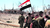 enfrentamiento. Varios miembros del ejército sirio, en uno de los lugares debastados por la guerra.