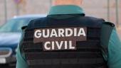 Agente de la Guardia Civil de espaldas. Archivo.