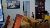 Fardos de droga y armas incautados en una casa rural en la desembocadura del Guadalquivir. / Guardia Civil.