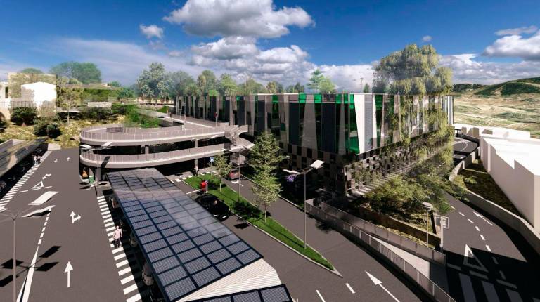 <i>Recreación de la vista trasera del centro de salud, donde se sitúa parte del aparcamiento en superficie con pasarelas de acceso y paneles fotovoltaicos.</i>