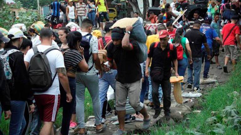 Unos 40.000 venezolanos cruzan a diario la frontera