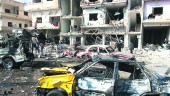 TERRORISMO. Imagen sobre el estado en que quedó la ciudad de Homs, tras la explosión simultánea de dos coches bomba.