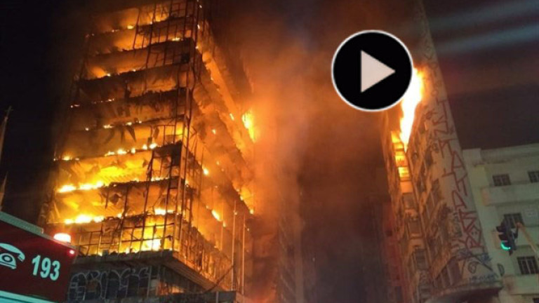 El derrumbe de un edificio en llamas causa al menos un muerto